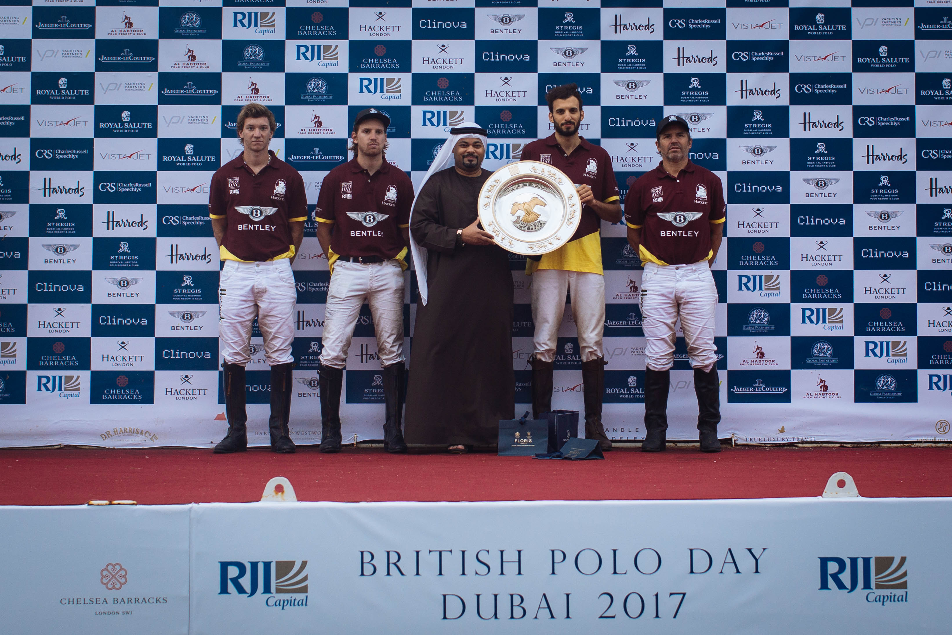 Mr Ghazi Al Madani presenting the  plate to to the victorious Bentley Habtoor Polo Team at BPD Dubai- Sam  Churchill-17.jpeg